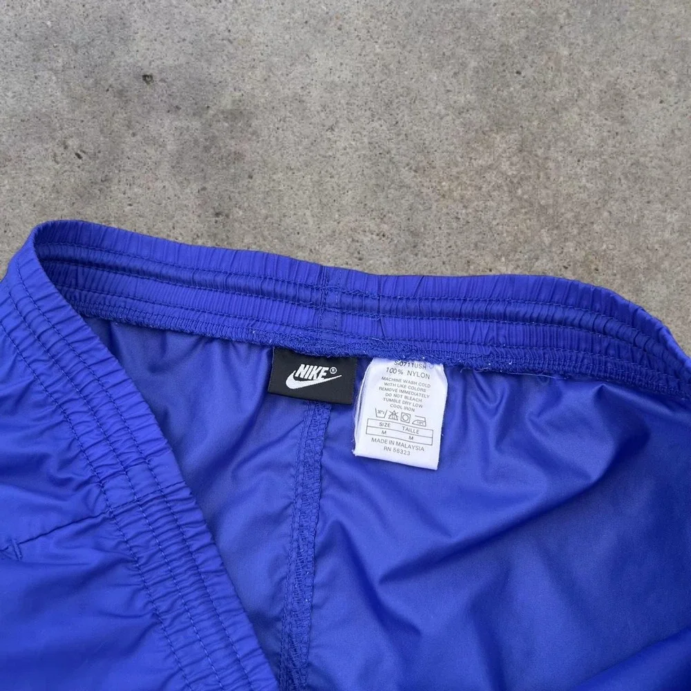 Vintage Y2K Era Nike Medium Royal Blue Nylon Windbreaker Track Pants 2007 Mens